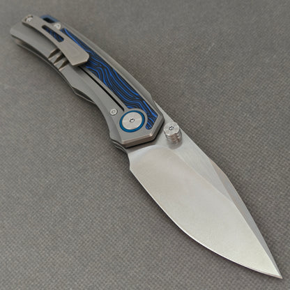 VORIXN KB005 open clip-side view showing pocket clip, bead-blasted titanium and G10 handle, and overall profile.