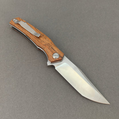 VORIXN KA013 open clip-side view showing pocket clip, golden sandalwood and steel handle, and overall profile.