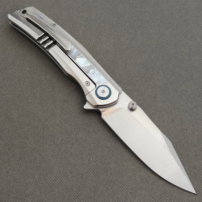 VORIXN Pearlglint KB159 folding knife, open pocket clip side showing white geometric inlays and a silver-tone blade.