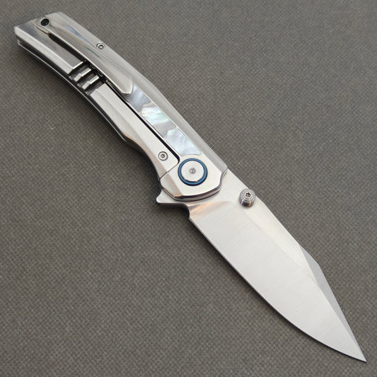 VORIXN Pearlglint KB159 folding knife, open pocket clip side showing white geometric inlays and a silver-tone blade.