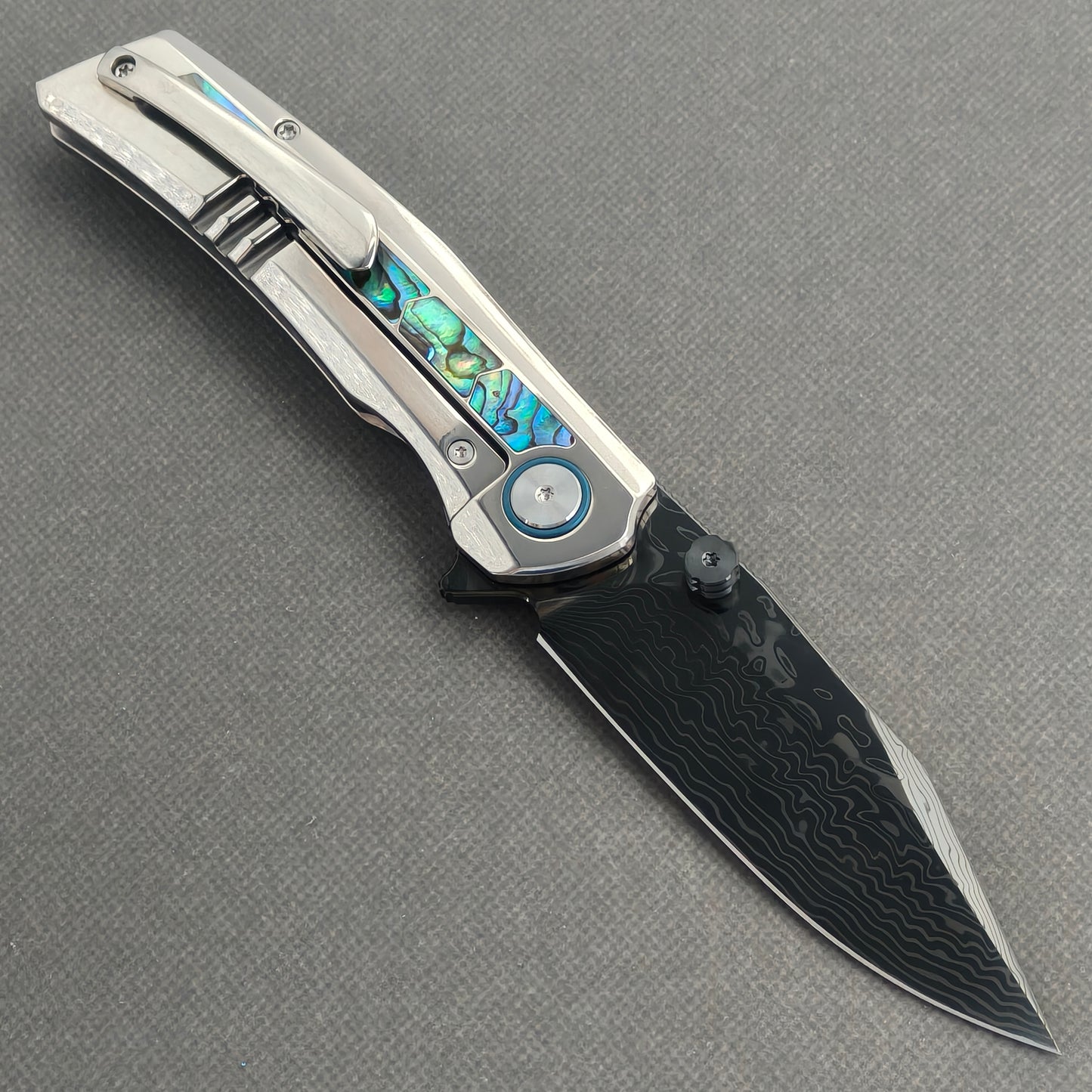 VORIXN Ocean Mirage KB130 Folding Knife – open clip side view showing pocket clip and abalone shell inlay titanium handle
