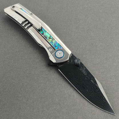 VORIXN Ocean Mirage KB130 Folding Knife – open clip side view showing pocket clip and abalone shell inlay titanium handle