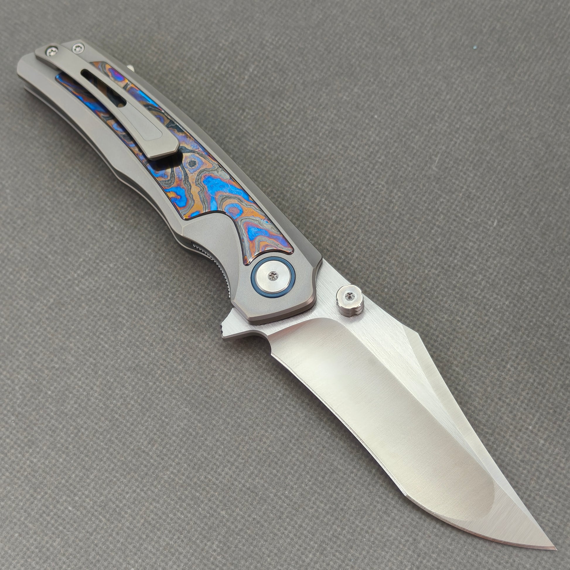 VORIXN KB030 Abyssal Folding Knife – open clip side view showing pocket clip and Zirconium handle profile