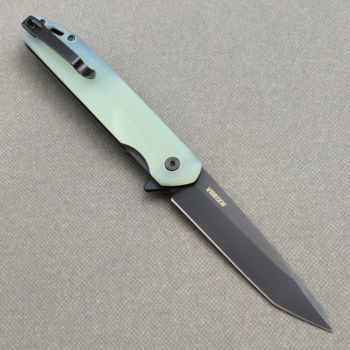 VORIXN KM005 open clip side view showing pocket clip and carbon fiber handle.
