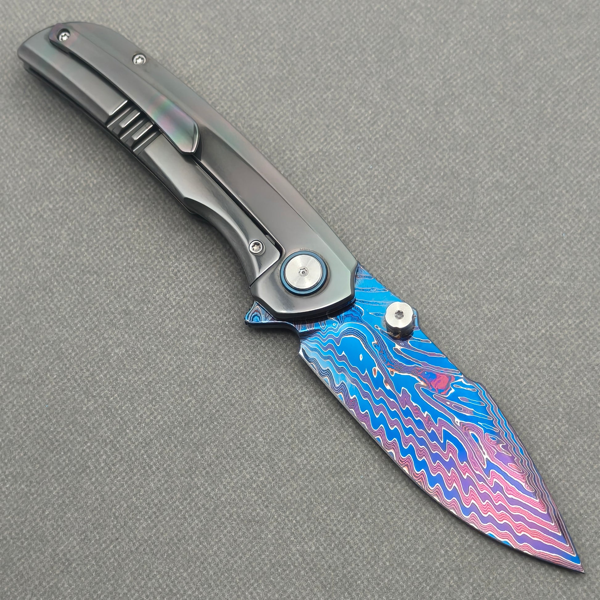 VORIXN Spectra KB127 Folding Knife – open clip side view showing pocket clip and zirconium handle