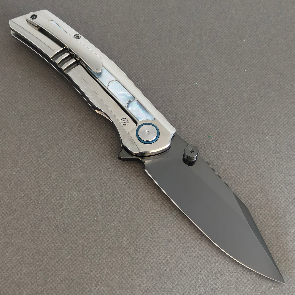 VORIXN Pearlcrest KB158 Folding Knife – open clip side view showing dark blade, pocket clip, and mother-of-pearl inlays.