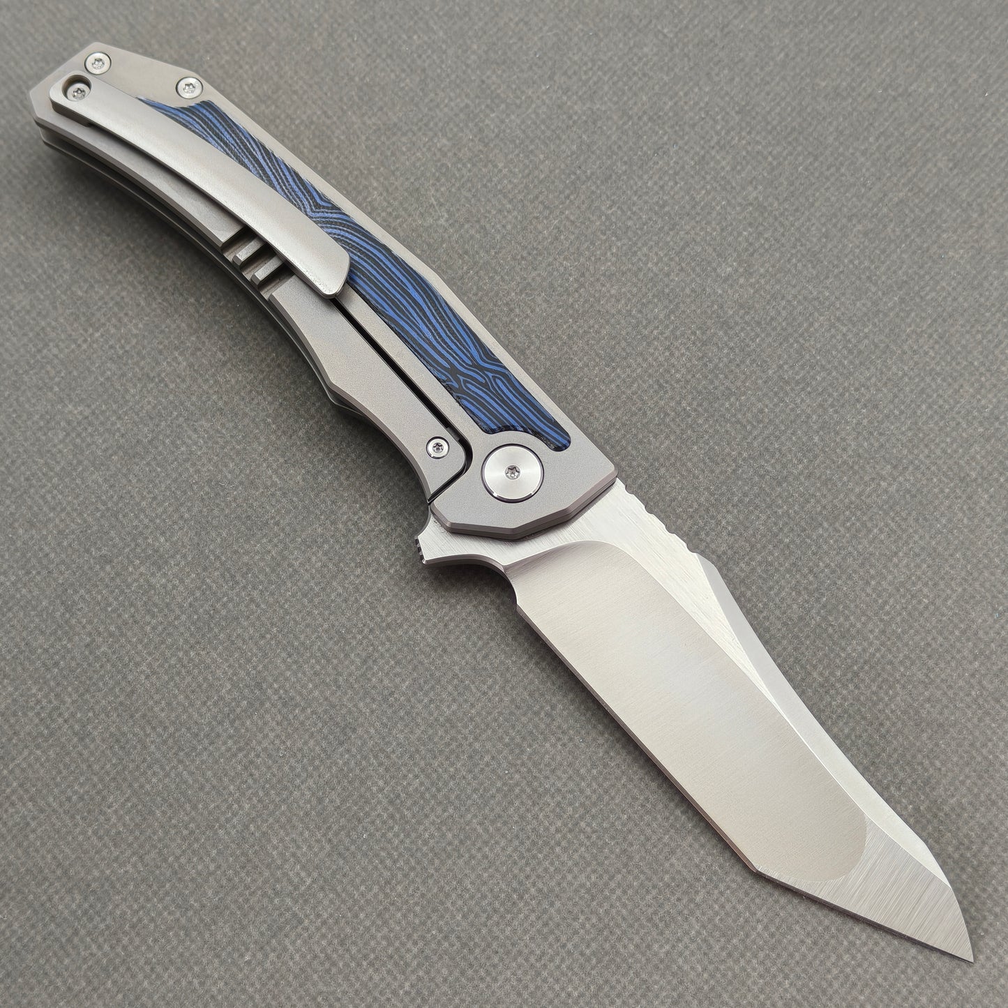 VORIXN Carbon Crest KB003 Folding Knife – open clip side view showing pocket clip and Titanium & G10 handle