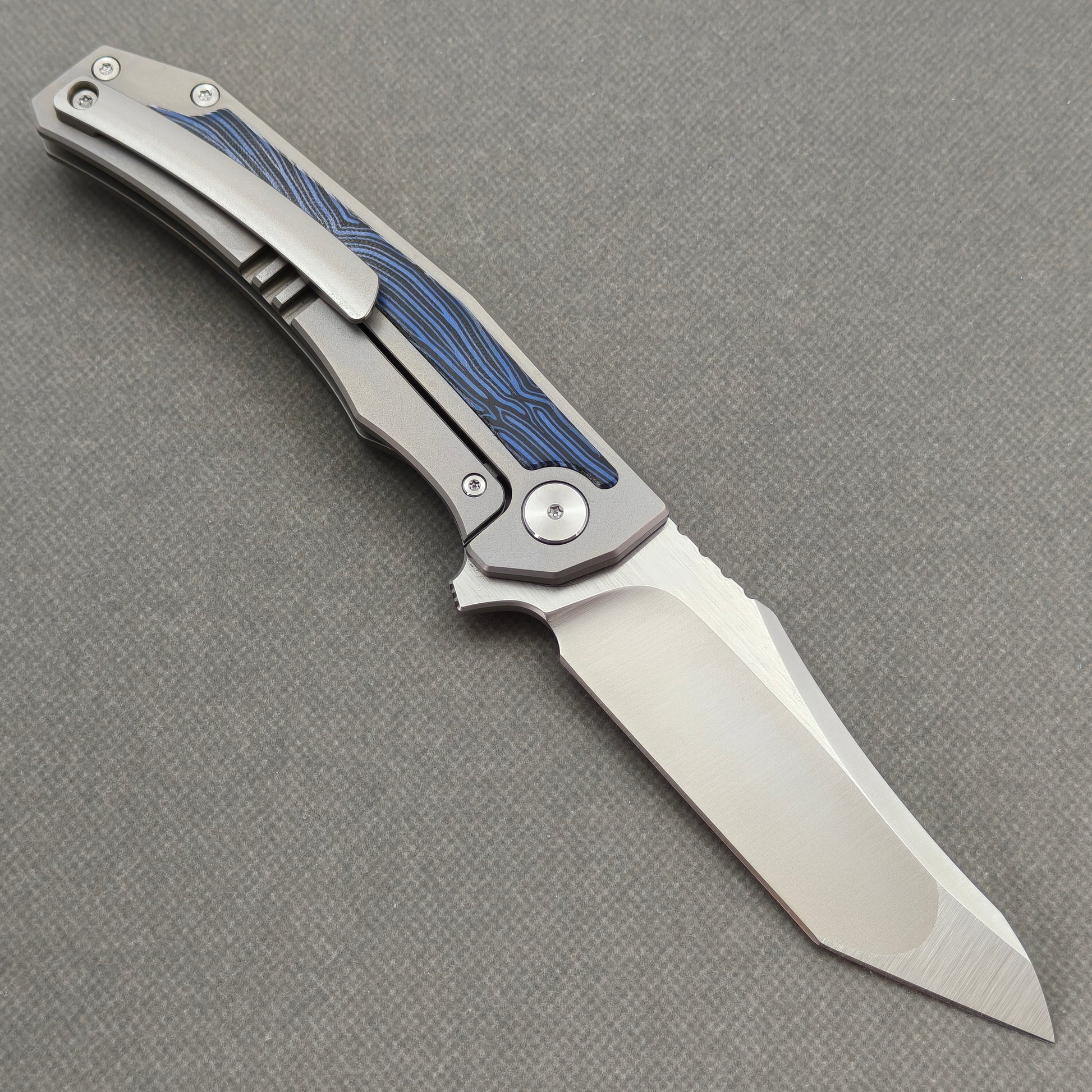 VORIXN Carbon Crest KB003 Folding Knife – open clip side view showing pocket clip and Titanium & G10 handle