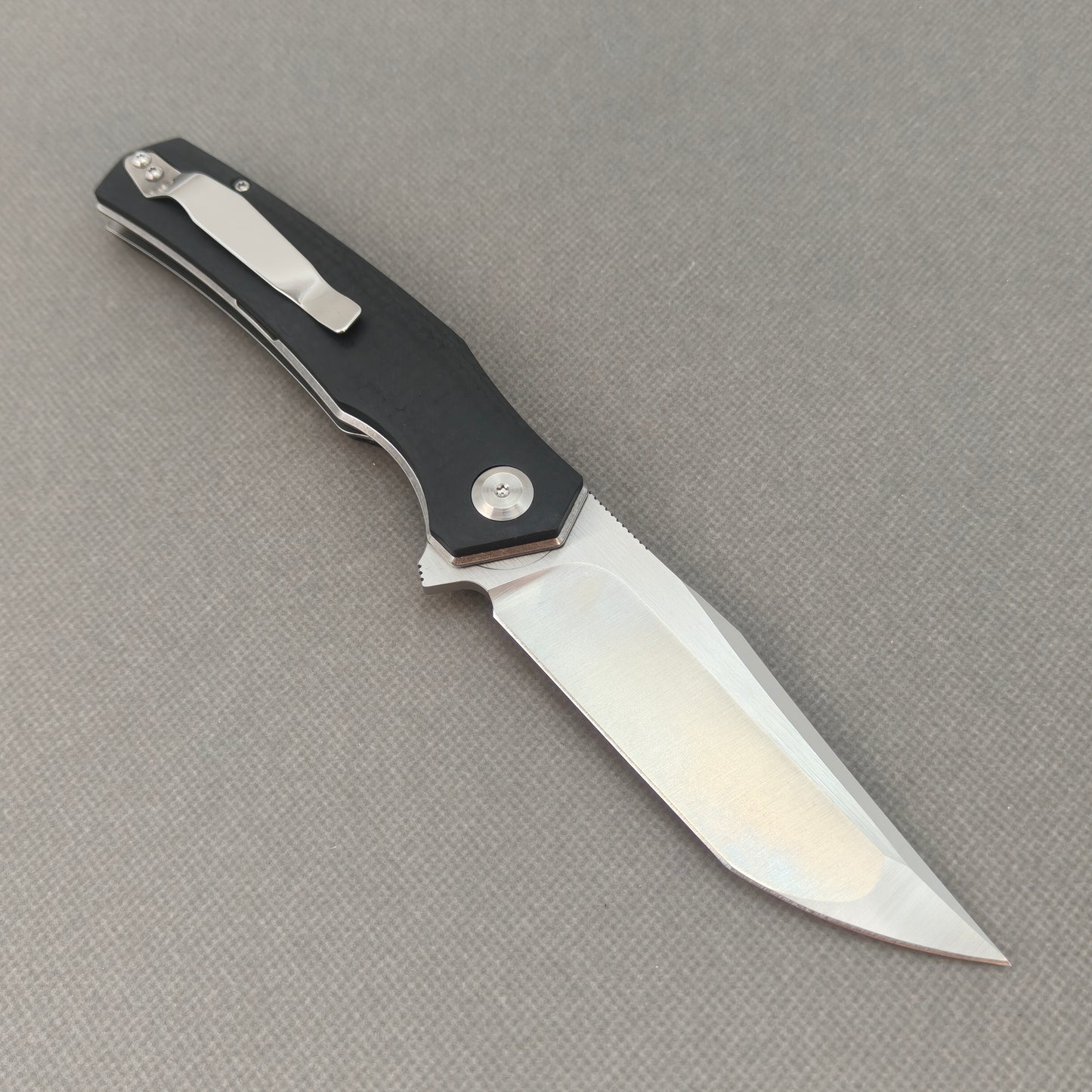 VORIXN KA006 open clip-side view showing pocket clip, black G10 handle structure, and overall profile.