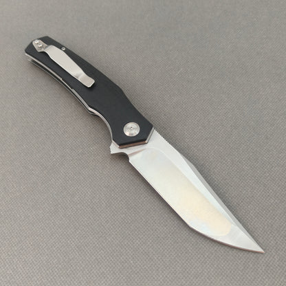 VORIXN KA006 open clip-side view showing pocket clip, black G10 handle structure, and overall profile.