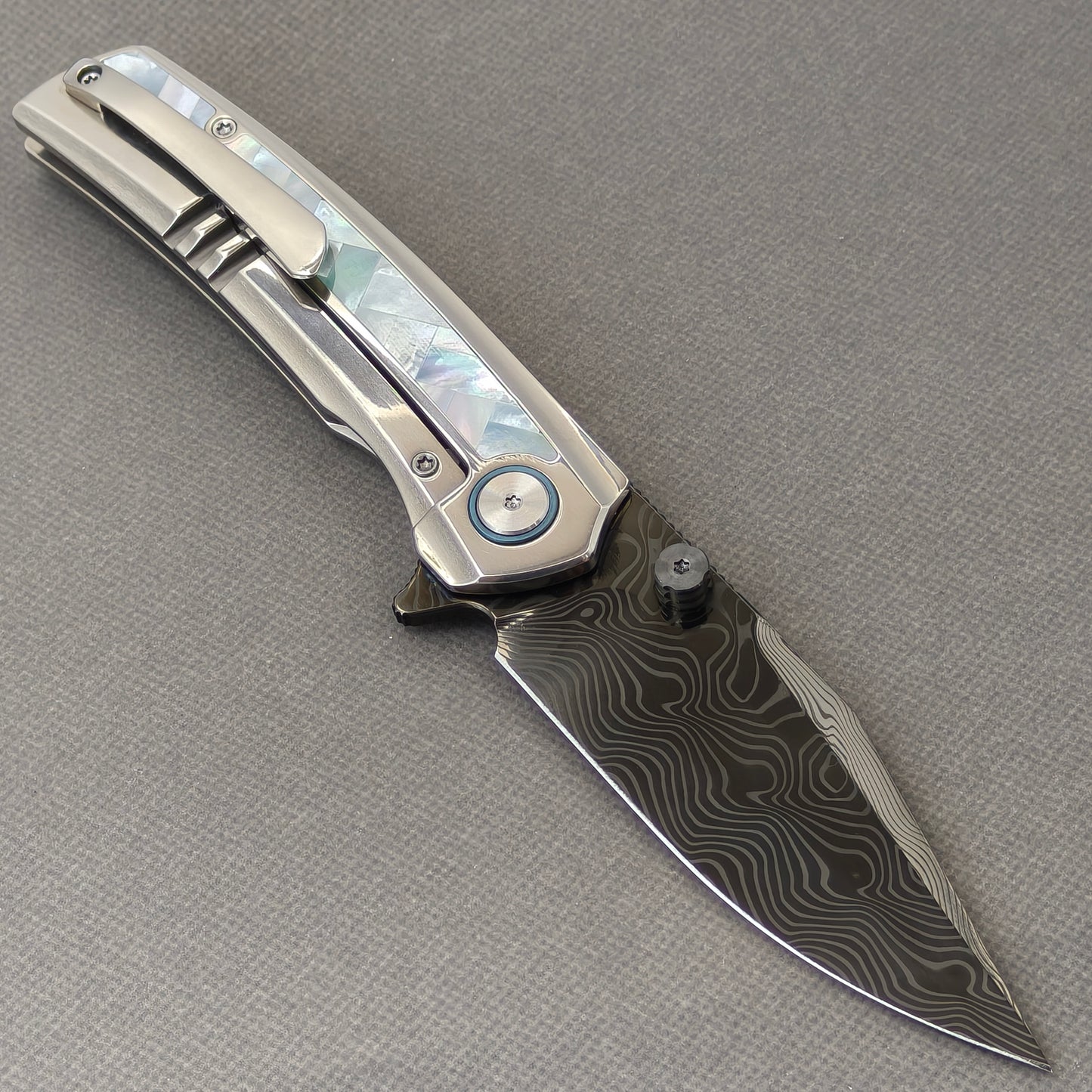 VORIXN Ocean Mirage KB104 Folding Knife – open clip side view showing pocket clip and White Mother-of-Pearl Inlaid Titanium handle