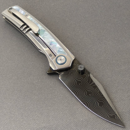 VORIXN Ocean Mirage KB104 Folding Knife – open clip side view showing pocket clip and White Mother-of-Pearl Inlaid Titanium handle