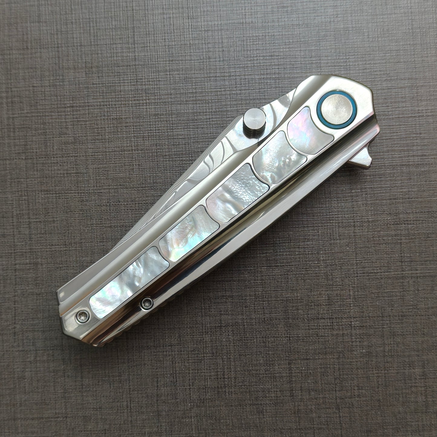 VORIXN Ocean Mirage folding knife closed, non-clip side, showcasing mother-of-pearl handle artwork and overall profile