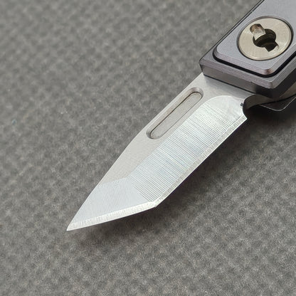 VORIXN NA005 Super Tiny Folding Knife – blade detail showing Cr20Mo1V4 steel and edge