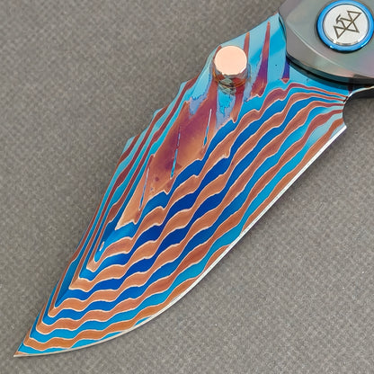 VORIXN Steelwraith KB143 Folding Knife – blade detail showing Damascus steel pattern and edge.