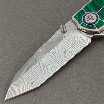 VORIXN KB062 non-clip side blade detail showing the Damascus blade pattern.