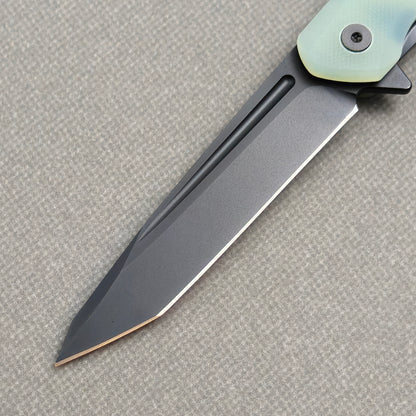 VORIXN KM005 clip side blade detail showing D2 steel and carbon fiber handle junction.