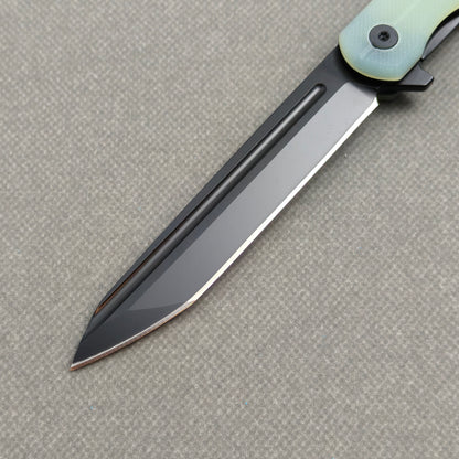 VORIXN KM004 clip side blade detail showing D2 steel and carbon fiber handle junction.