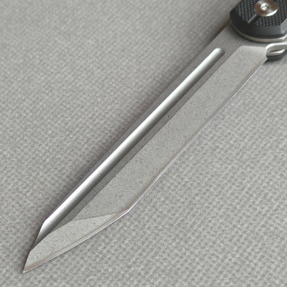 VORIXN KM001 non-clip side blade detail showing the D2 stonewashed blade.