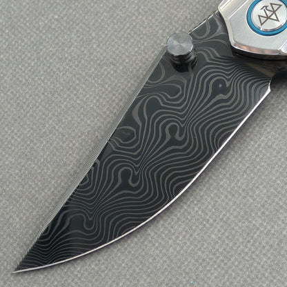VORIXN Forest Mirage KB131 Folding Knife – blade detail showing Damascus steel pattern and edge