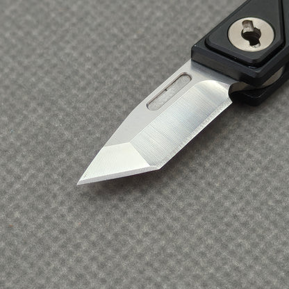 VORIXN NA001 Super Tiny Folding Knife – blade detail showing Cr20Mo1V4 steel and edge