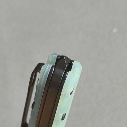 VORIXN KM004 closed rear handle end detail showing metal tail tip and handle construction.