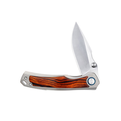 VORIXN Ironwood Crest folding knife partially open on non-clip side, emphasizing flipper and thumb stud deployment