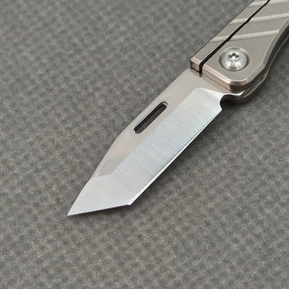 VORIXN NA002 Super Tiny Folding Knife – closed non-clip side view showing Titanium handle