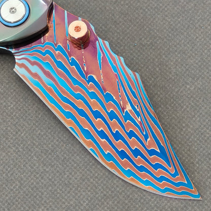 VORIXN Steelwraith KB143 Folding Knife – clip side blade detail showing Damascus steel and Zirconium handle junction.