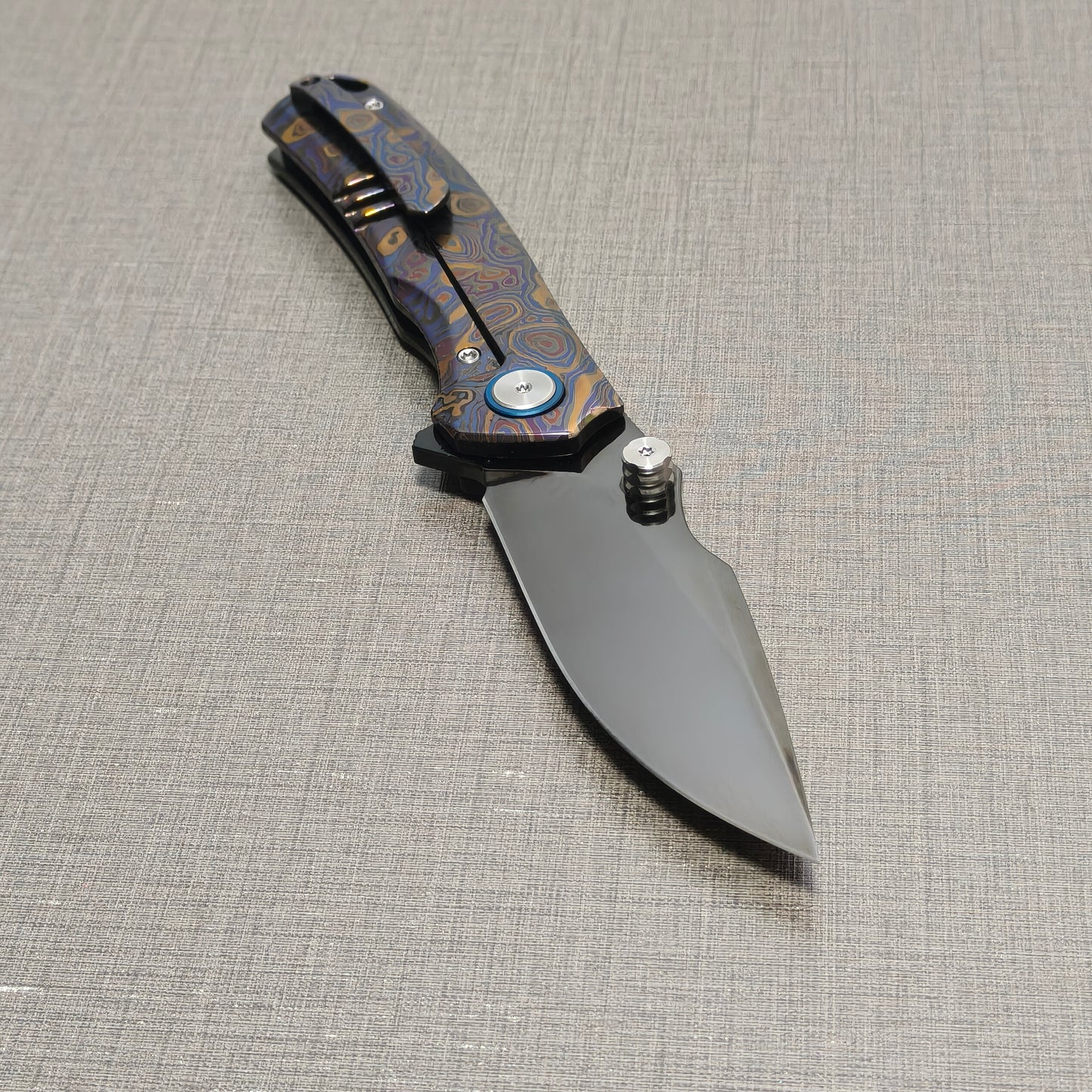 VORIXN Topograph folding knife open with pocket clip side visible, blade angled downward at 45 degrees
