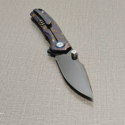 VORIXN Topograph folding knife open with pocket clip side visible, blade angled downward at 45 degrees
