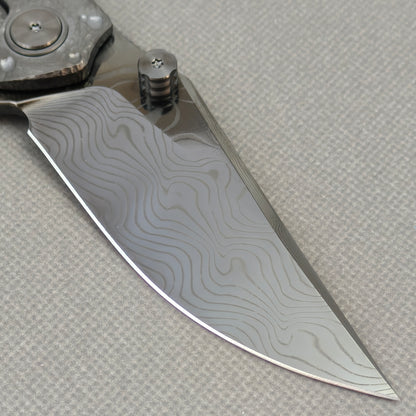 VORIXN KB098 Impact Origin Folding Knife – blade detail showing Damascus steel pattern and edge