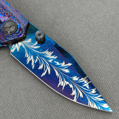 VORIXN KB082 Aurora Black Folding Knife – clip side blade detail showing Damascus steel and handle junction