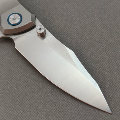 VORIXN KB014 clip-side blade detail showing the 10Cr15CoMoV brushed finish blade.