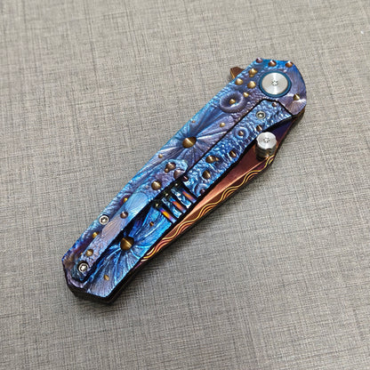 Impact Origin folding knife closed, clip side view with titanium pocket clip and engraved handle