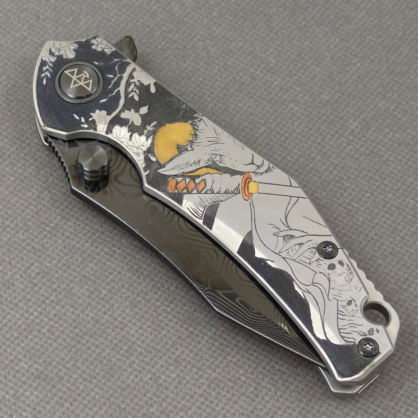 VORIXN Yokai KB106 Folding Knife – closed non-clip side view showing Laser-Engraved Copper Accents Titanium handle design and pivot