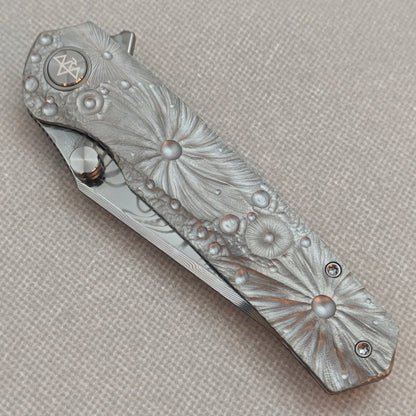 VORIXN KB098 Impact Origin Folding Knife – closed non-clip side view showing engraved Titanium handle design and pivot