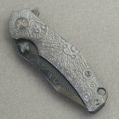 VORIXN Prism KB129 Folding Knife – closed non-clip side view showing hand-engraved anodized titanium handle design and pivot