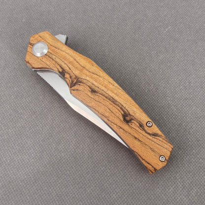 VORIXN KA013 closed non-clip side view showing golden sandalwood handle design and pivot detail.