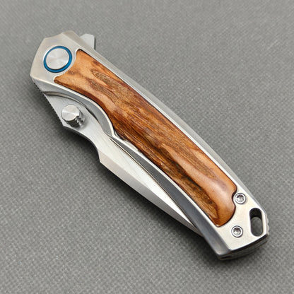 VORIXN KB043 closed non-clip side view showing titanium and natural stag inlay handle design and pivot detail.