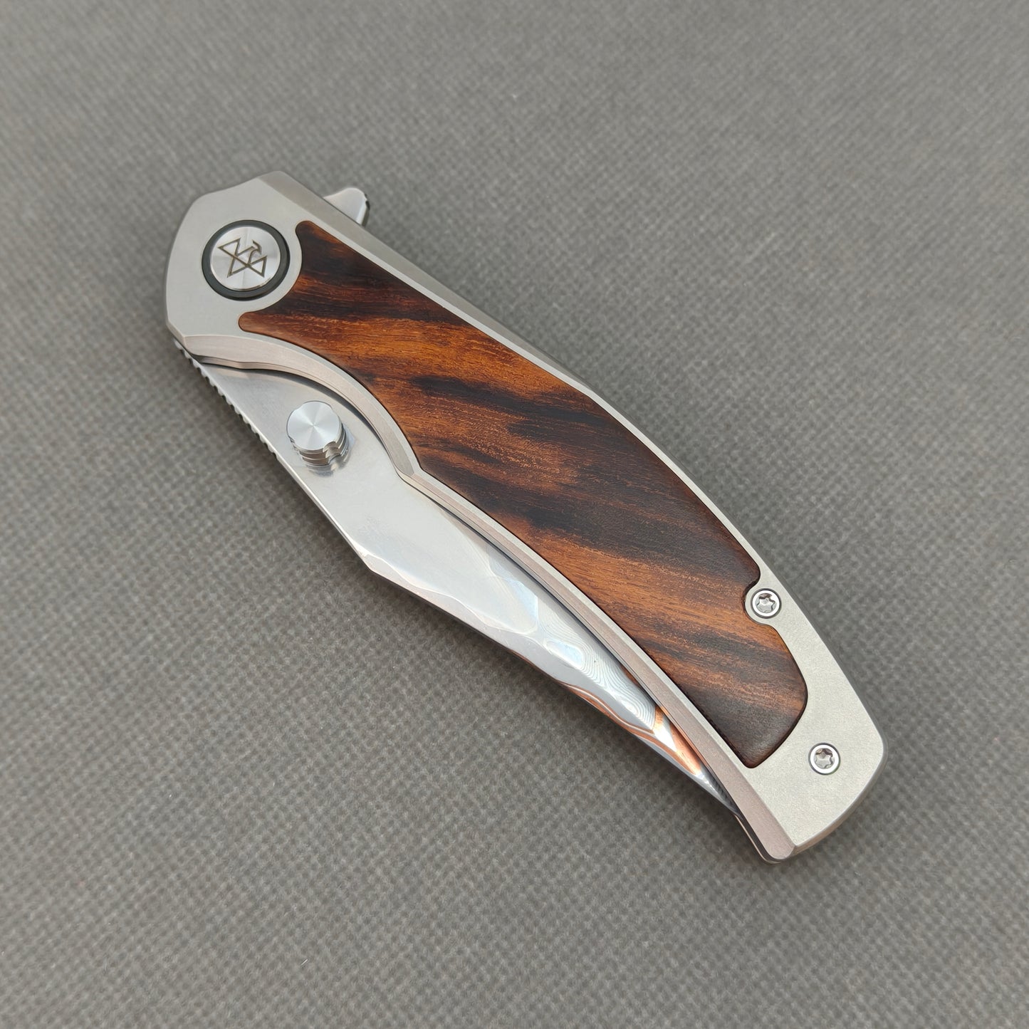 VORIXN KB074 closed non-clip side view showing titanium and ironwood handle design and pivot detail.