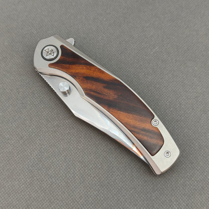 VORIXN KB074 closed non-clip side view showing titanium and ironwood handle design and pivot detail.