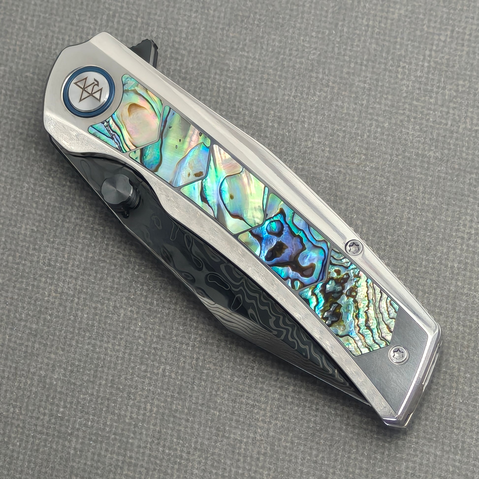 VORIXN Ocean Mirage KB130 Folding Knife – closed non-clip side view showing abalone shell inlay titanium handle design and pivot