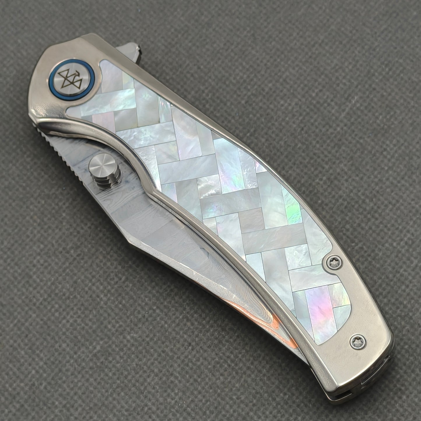 VORIXN KB068 closed non-clip side view showing white pearl inlaid titanium handle design and pivot detail.