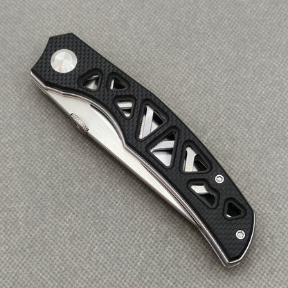 VORIXN KA003 closed non-clip side view showing black G10 handle design and pivot detail.