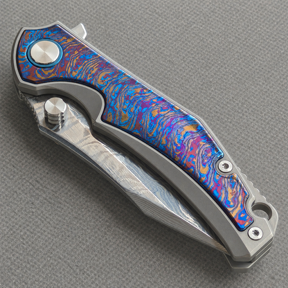 VORIXN KB031 closed non-clip side view showing hand-flamed titanium and zirconium inlay handle design and pivot detail.