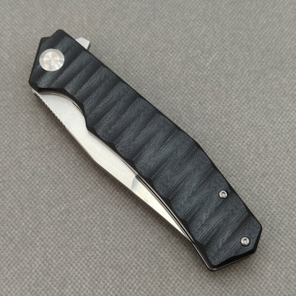 VORIXN KA002 closed non-clip side view showing black G10 handle design and pivot detail.