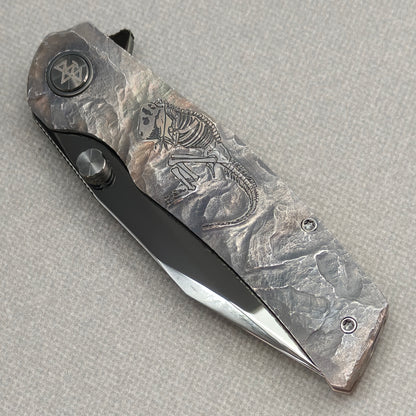 VORIXN Rex KB119 Folding Knife – closed non-clip side view showing hand-engraved titanium handle design and pivot