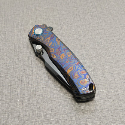 VORIXN Topograph folding knife closed, non-clip side highlighting zirconium handle pattern