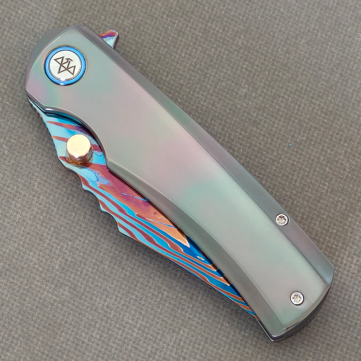 VORIXN Steelwraith KB143 Folding Knife – closed non-clip side view showing Zirconium handle design and pivot.